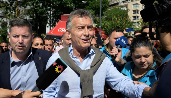 105082719-argentinas-former-president-2015-2019-mauricio-macri-gestures-on-arrival-at-a-polling.jpg