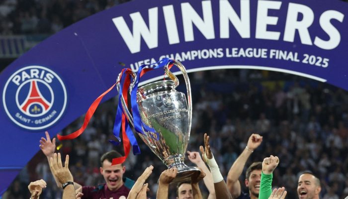 111253581-the-uefa-champions-league-trophy-is-lifted-in-the-air-as-paris-saint-germain-celebrate-win.jpeg